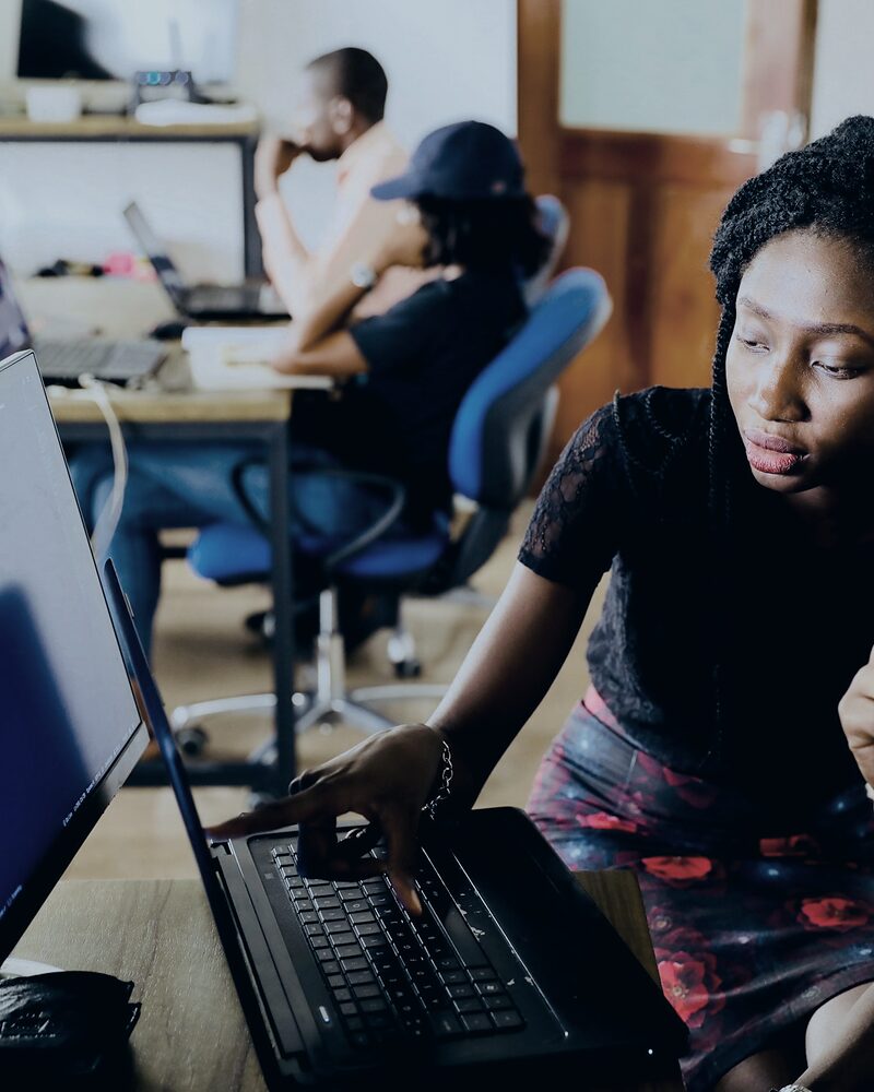 Two sales professionals collaborating at a workstation